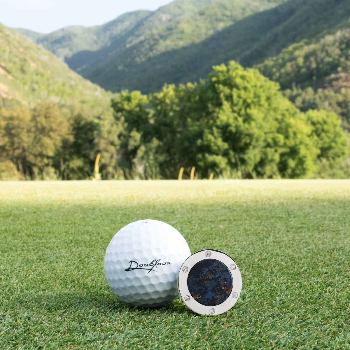The Skyfire Six Golf Ball Marker — alternate angle showing diamond and sterling silver finish