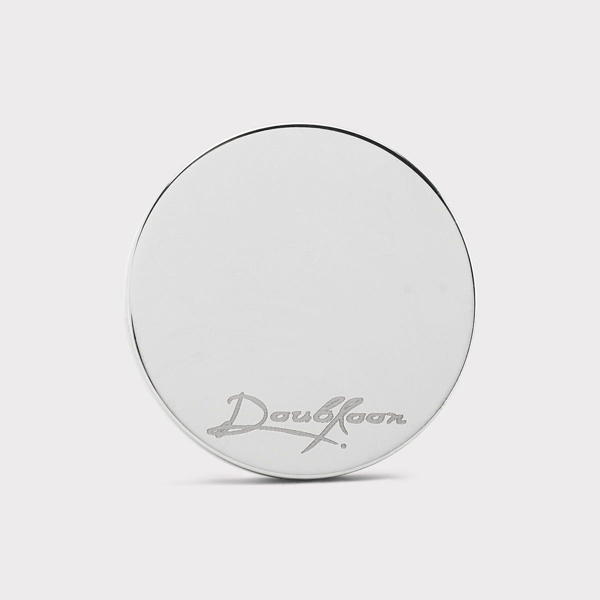 The Colossus Golf Ball Marker — back view showing precision tungsten weight