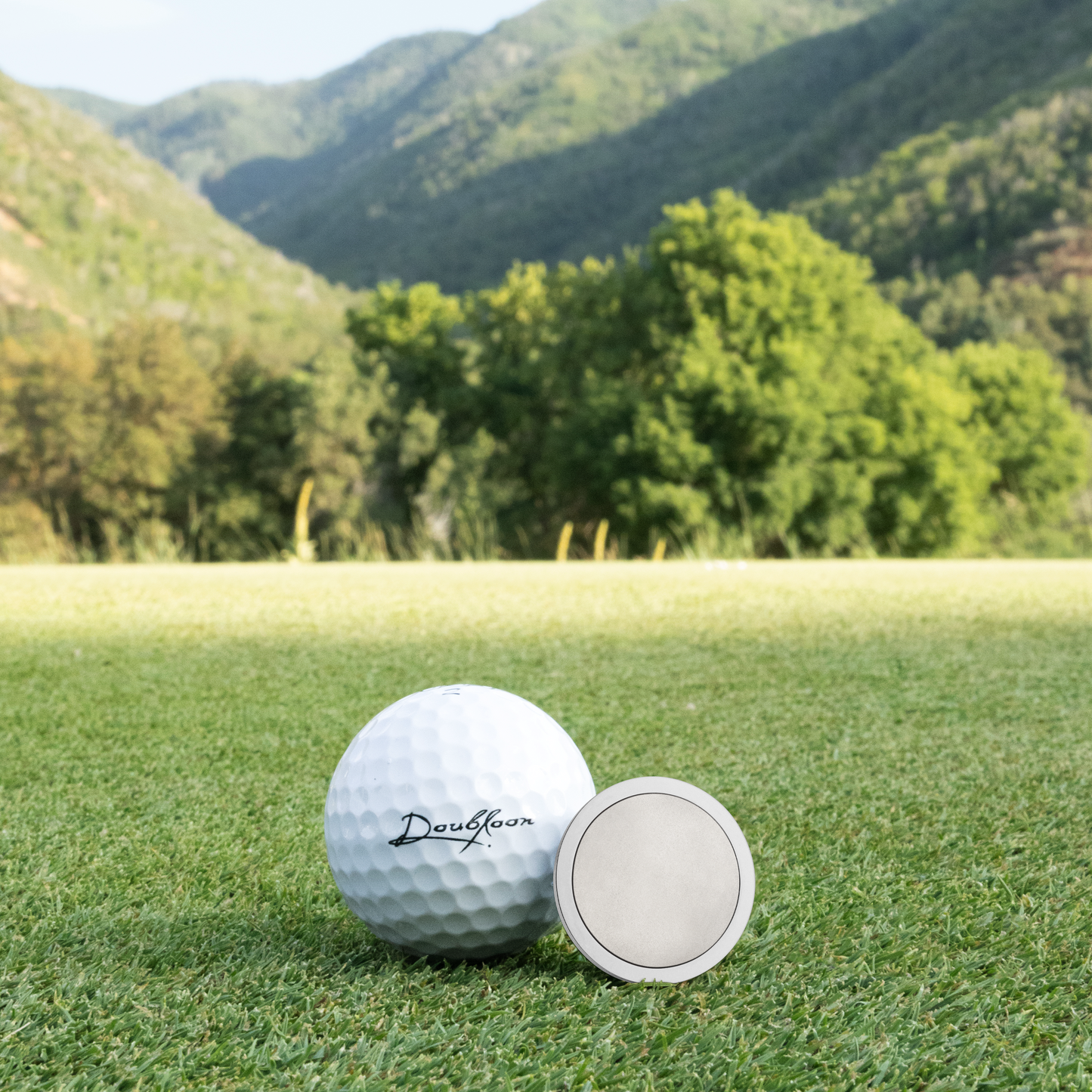 The New Moon Golf Ball Marker — scale comparison showing 30mm diameter