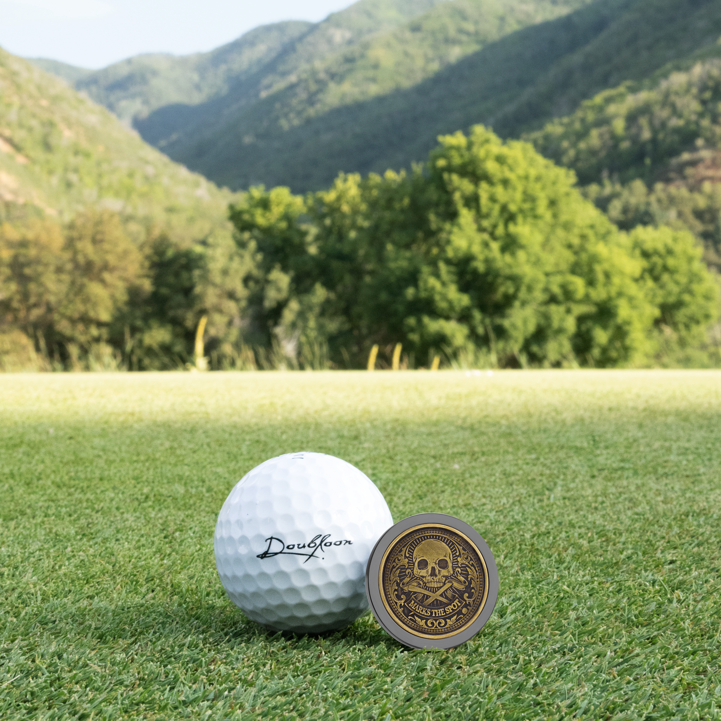 The Omen I Golf Ball Marker — alternate angle showing sterling silver and titanium finish