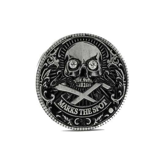 Decorative custom golf ball marker with skull design, diamonds in the eyes and 'X Marks the Spot' text on a white background